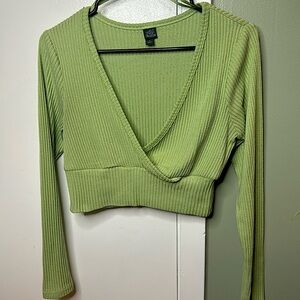 Dress cover, low v-cut sweater material in color pastel green.